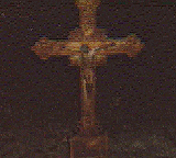 An old, iron, cross grave marker